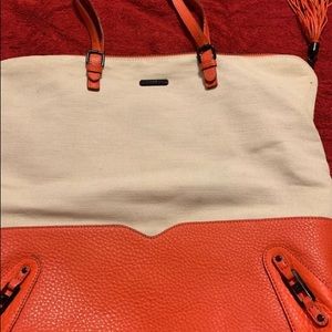 A Rebeccaminkoff tangerine,beige handbag once worn